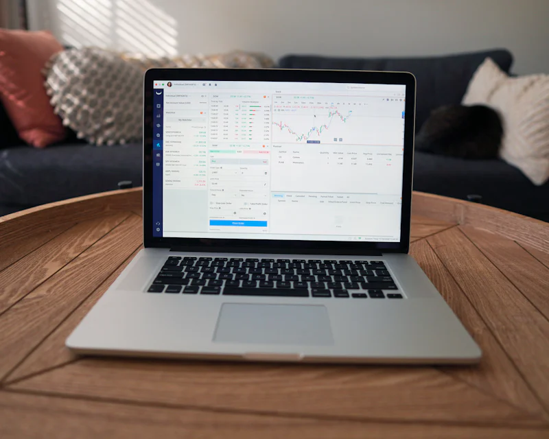 Laptop showing invoice data in a spreadsheet